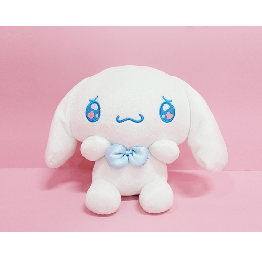 "Cinnamoroll Sanrio plush toy with blushing cheeks, blue bow, and shy pose – soft white stuffed animal for kawaii collectors and sweet gift ideas"