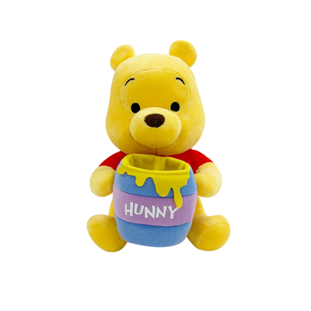 Winnie the Pooh plush toy holding a colorful “Hunny” pot with yellow honey drips, wearing a red shirt and sitting upright — perfect gift for Disney fans and children.