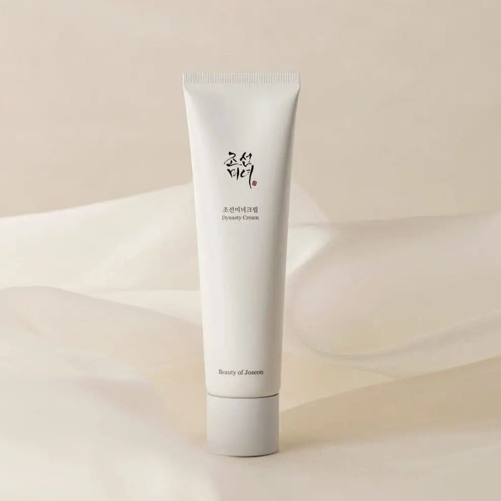 White tube of cream on a beige fabric background