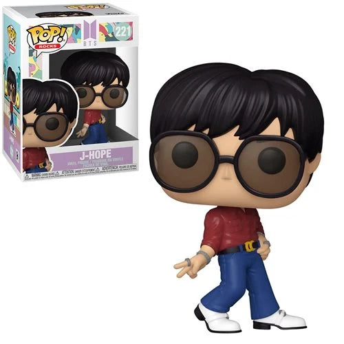 Funko Pop! Rocks BTS Dynamite J-Hope vinyl figure (#221) featuring large sunglasses, red shirt, blue jeans, and white shoes in retro dance pose with product box in background.