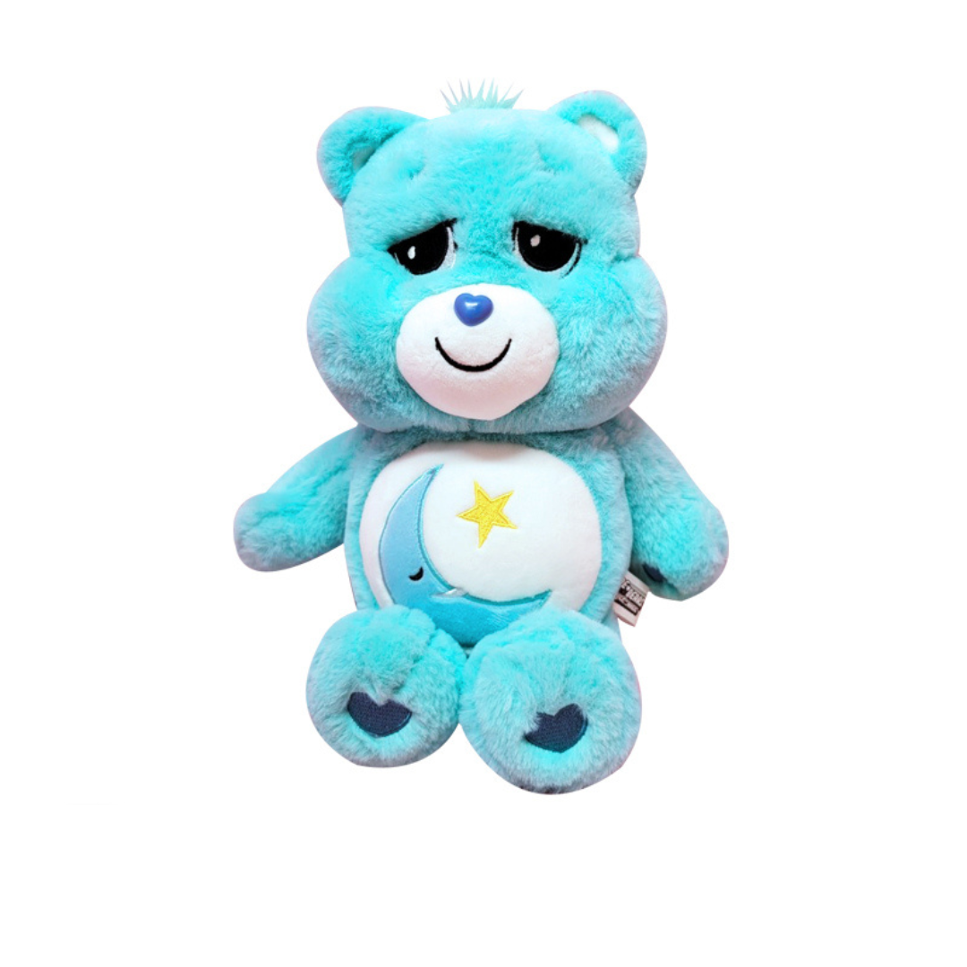 "Bedtime Bear Care Bears plush toy in soft aqua blue with crescent moon and star belly badge – cuddly stuffed animal for kids, sleep routines, and bedtime gifts"