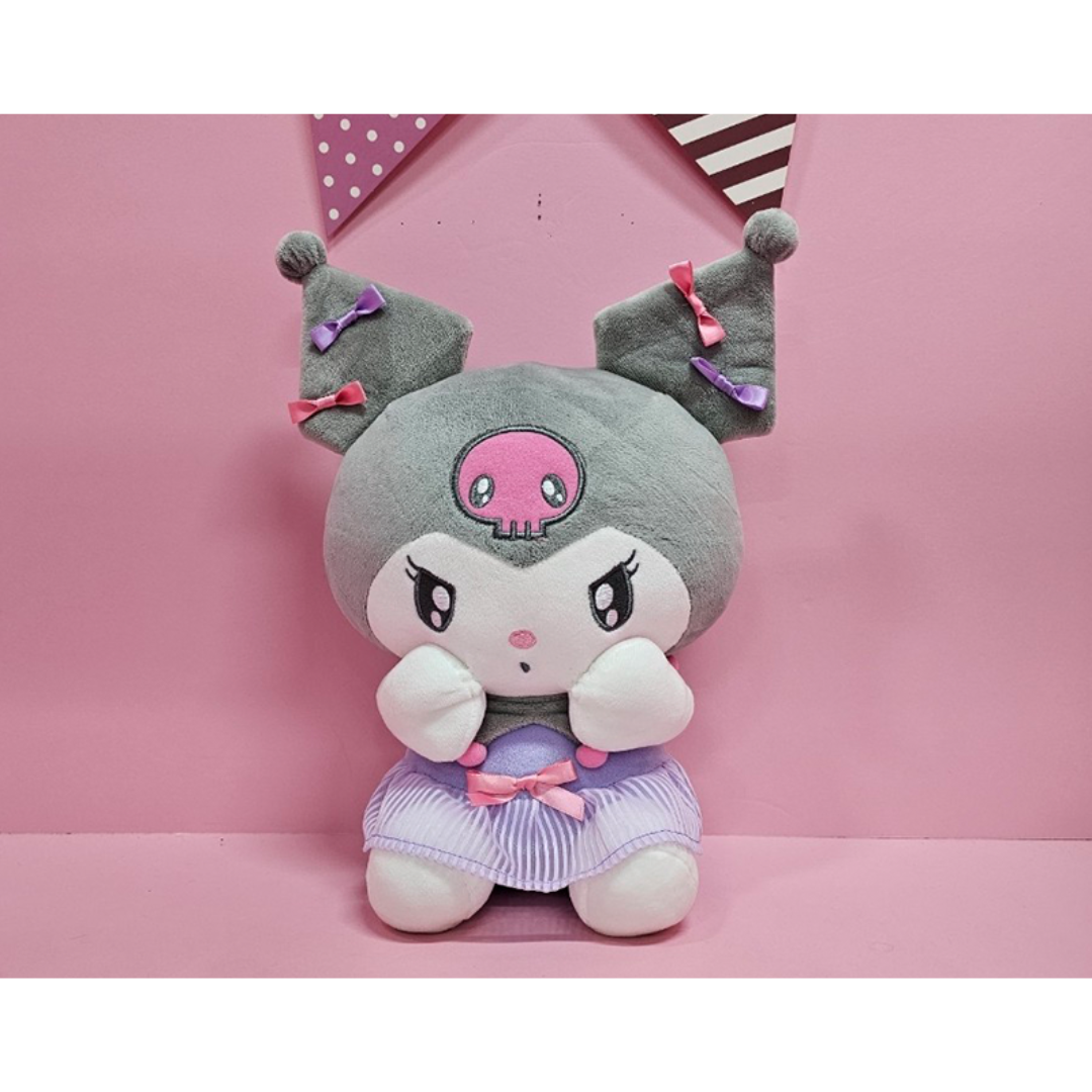 Kuromi plush doll with pink and purple ribbons and a lavender striped skirt, seated against a pink backdrop.