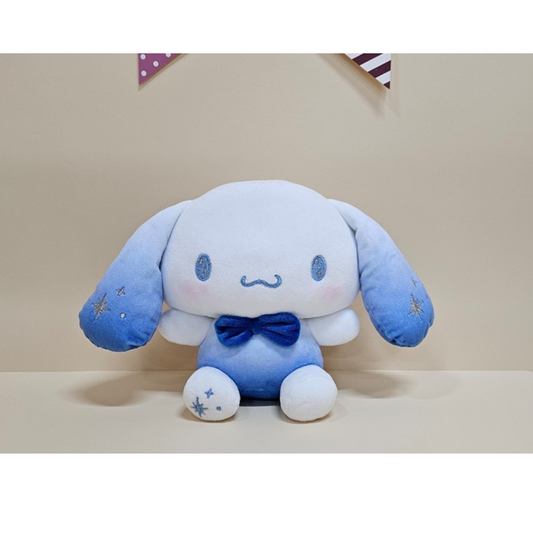 Soft Cinnamoroll plush in a blue ombré outfit with embroidered stars and a satin bowtie, perfect for collectors and fans of Sanrio characters.