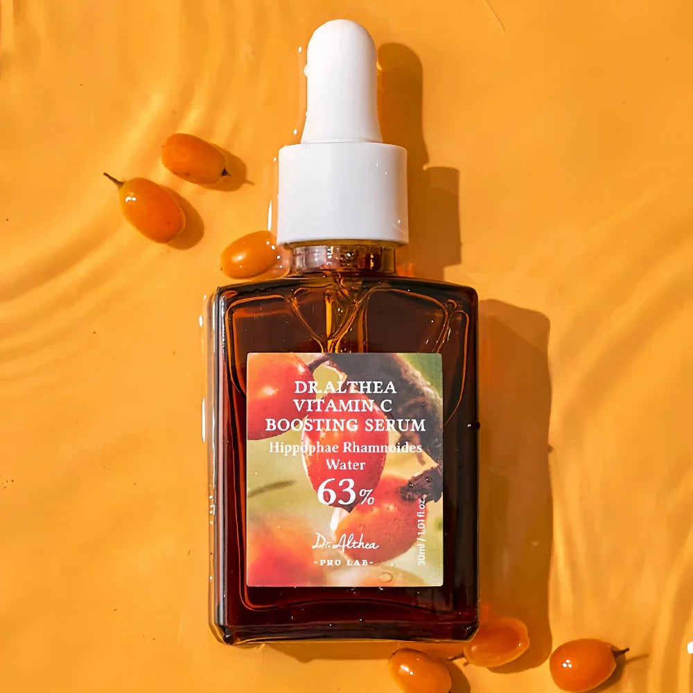 Dr. Athea Vitamin C Boosting Serum bottle with dropper on a yellow background