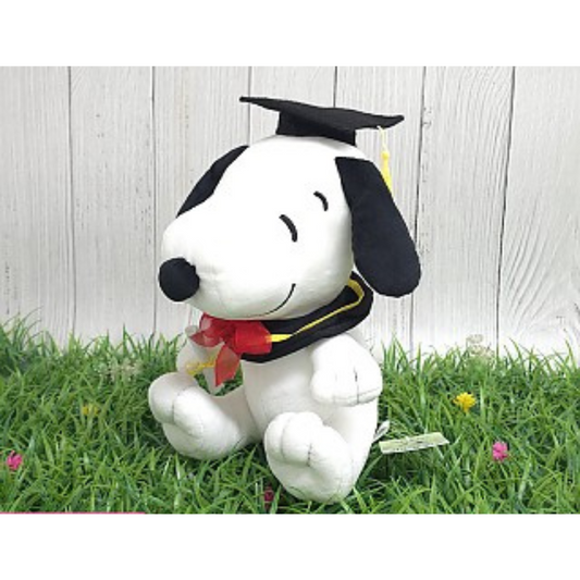 Graduation-themed Snoopy plush wearing a cap and gown, a perfect gift for graduates and Peanuts fans.