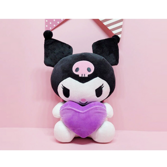 “Kuromi plush doll holding a purple heart pillow – Sanrio character with black jester hood and pink skull detail, cute and mischievous gift idea.”