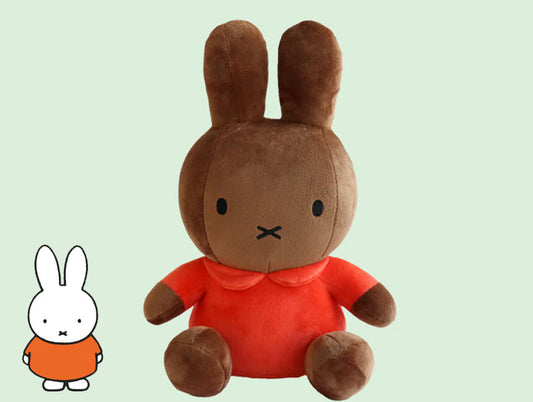 Brown Miffy bunny plush toy wearing red dress with collar, soft and cuddly stuffed animal featuring minimalist facial design, perfect for kids, collectors, and gift-giving.