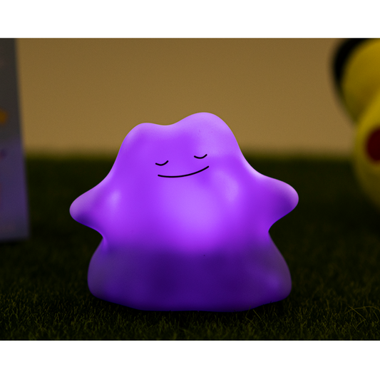 Cute purple Pokémon Ditto Metamong LED night light glowing with a peaceful face, perfect for children's bedrooms, gaming rooms, or collectors of kawaii Pokémon accessories.