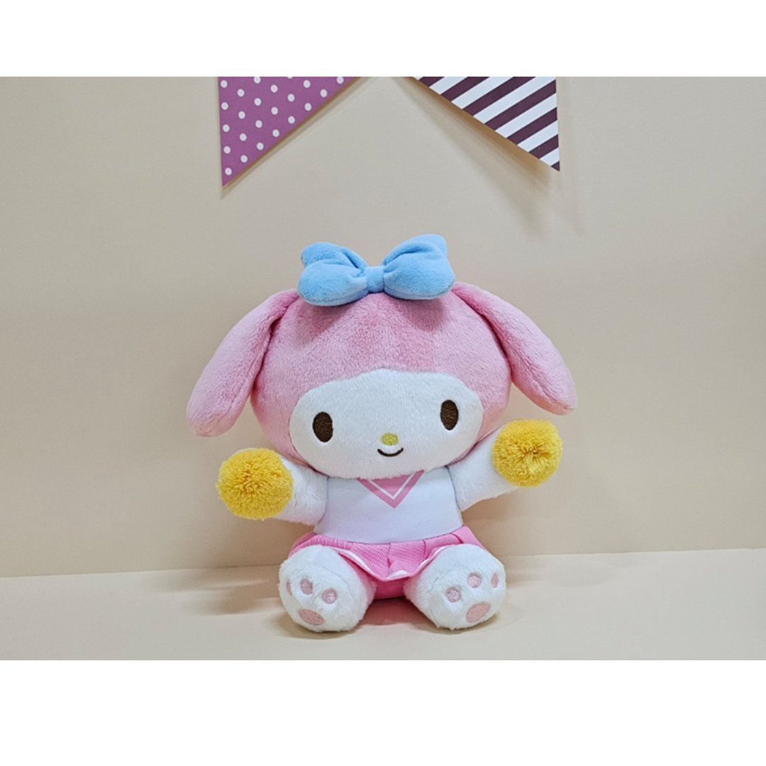 Pink and white My Melody plush in a cheerleader outfit with yellow pom-poms and a pastel blue bow, great for fans of sweet kawaii characters.
