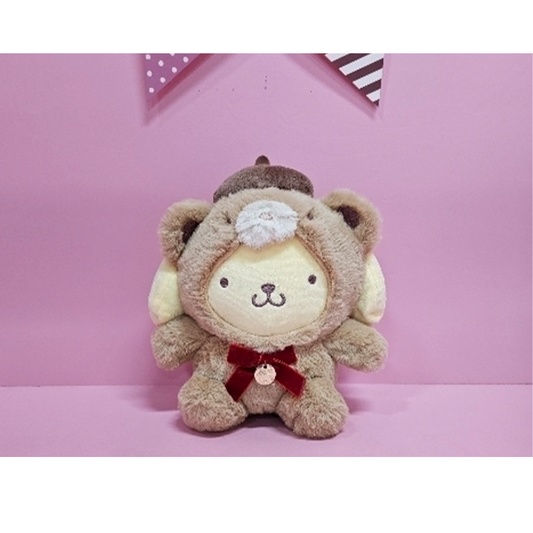 Latte edition Pompompurin plush dressed in a brown bear suit with red velvet bow and bell detail.