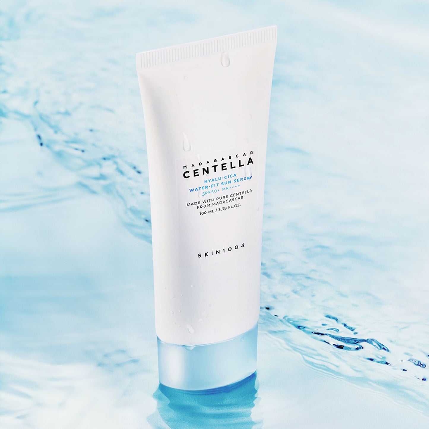 Skincare tube labeled 'Bacopa Centella' on a water background