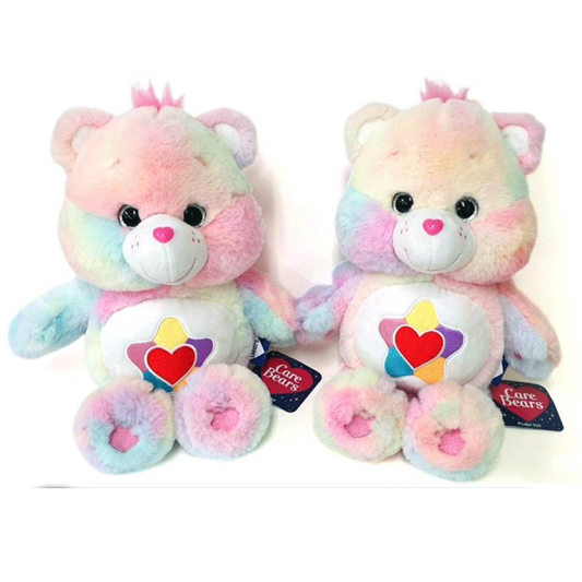 Care Bears True Heart Bear plush with rainbow pastel fur, pink heart nose, and embroidered belly badge of heart and star – collectible soft toy