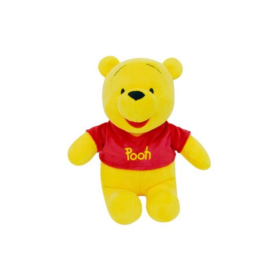 Plush toy of Winnie the Pooh wearing a red shirt with "Pooh" embroidered on it, sitting upright against a white background.