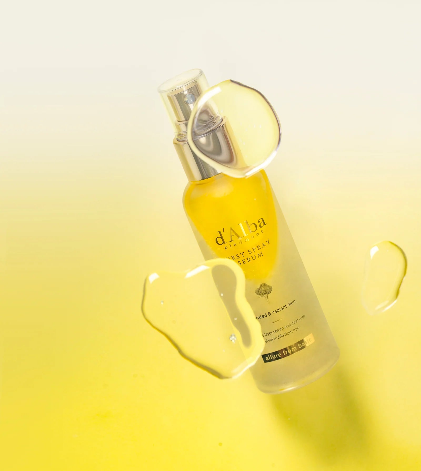 Skincare serum bottle with droplet on a yellow gradient background